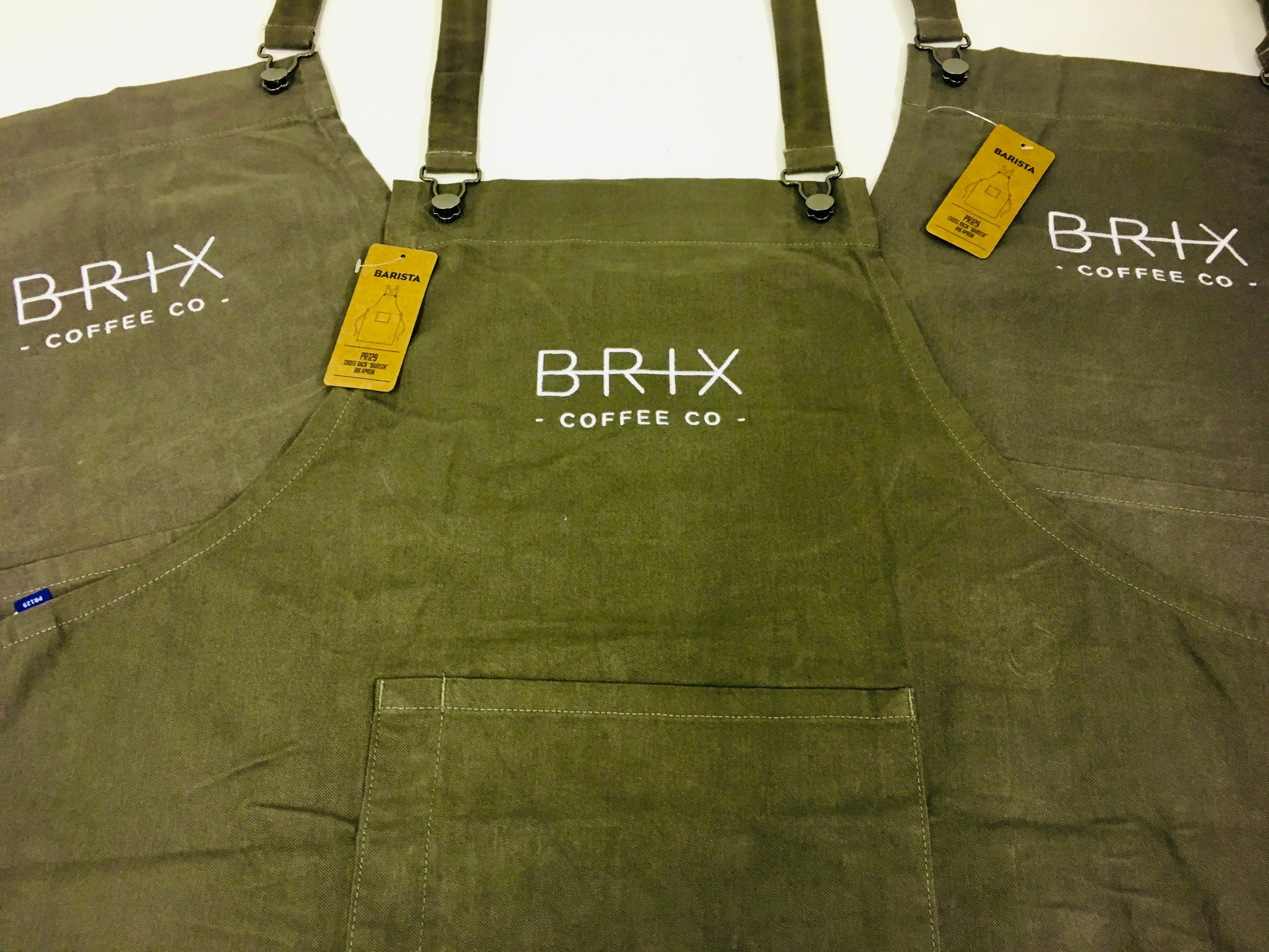 Professional, durable embroidered logos to the front of heavy-duty bib apron - ColorCoded Workwear