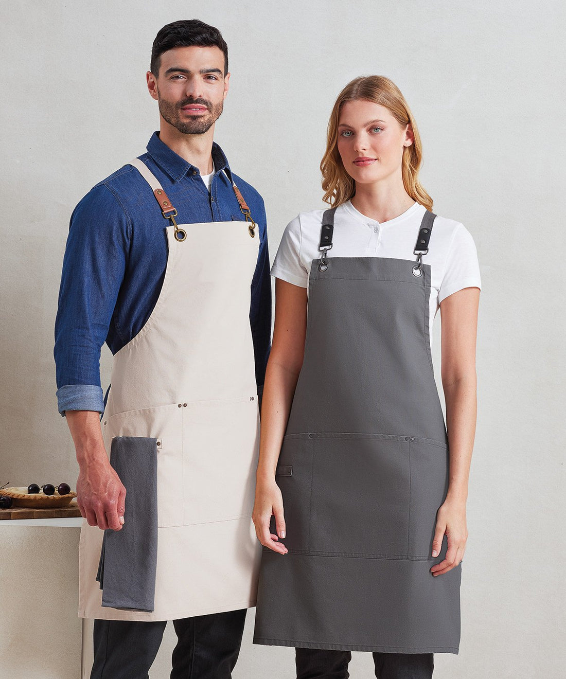 Hospitality staff wearing Premier bib aprons - Color Coded Workwear
