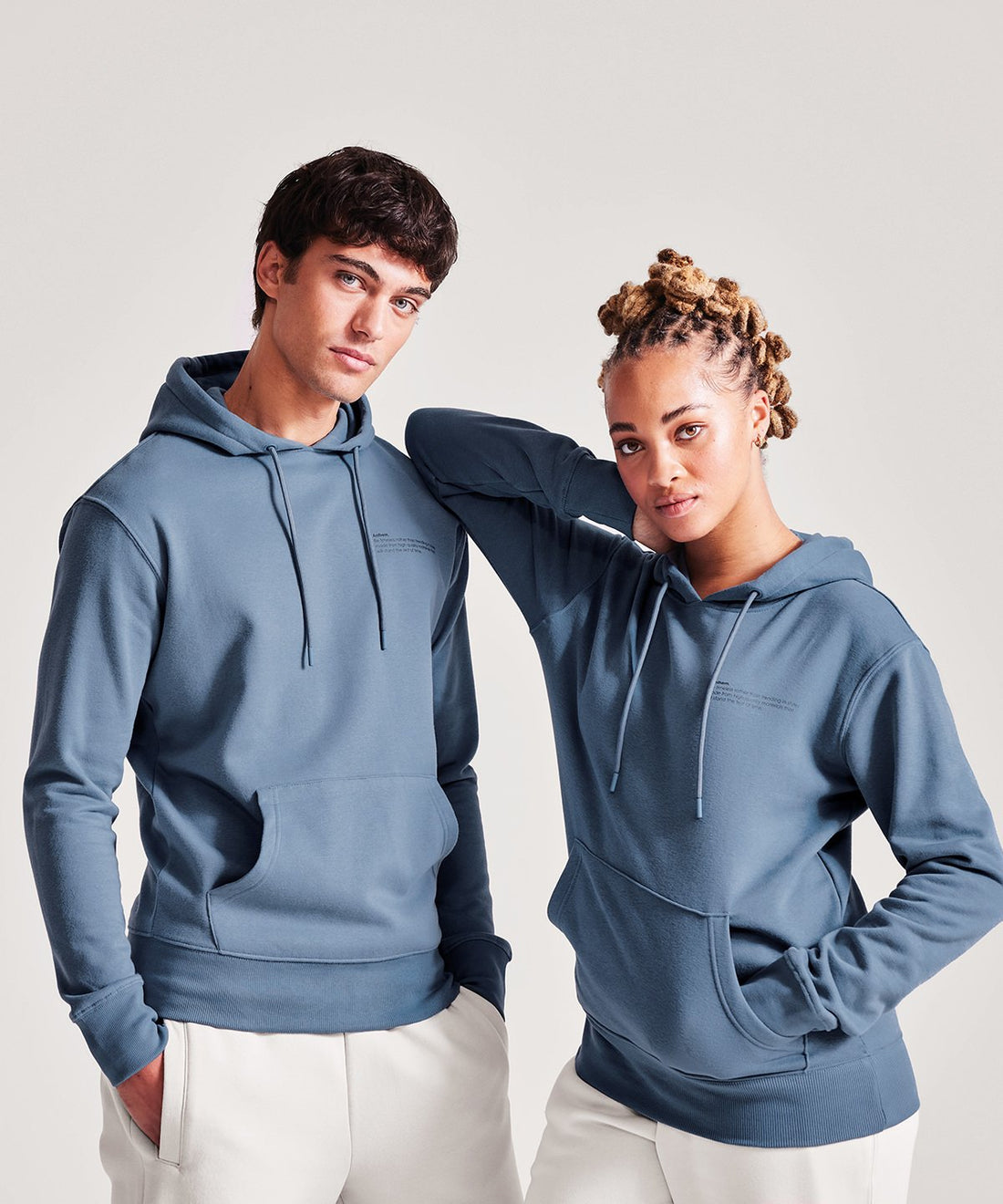 Two models wearing sustainable and organic hoodies - ColorCoded Workwear