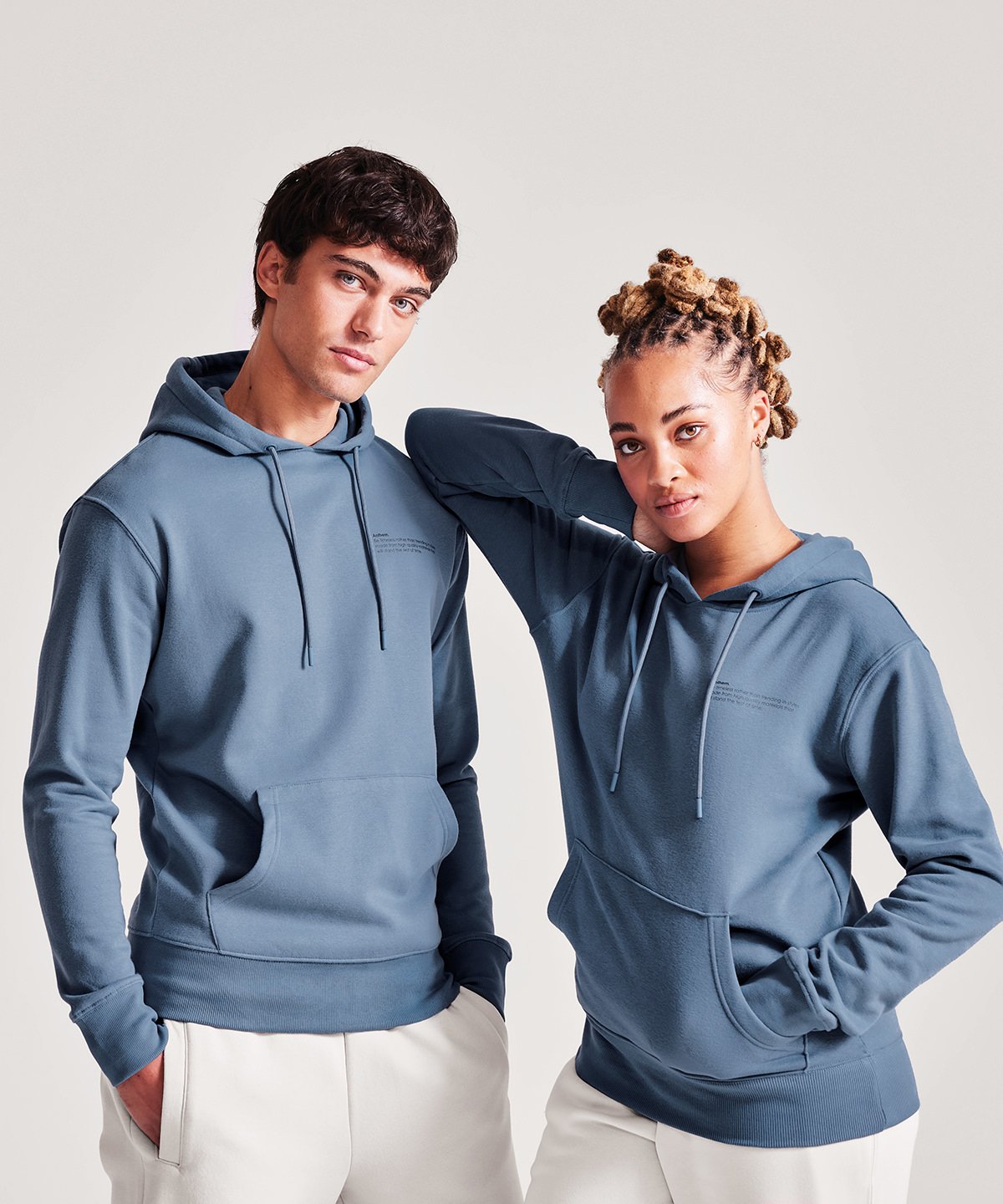 Two models wearing sustainable and organic hoodies - ColorCoded Workwear