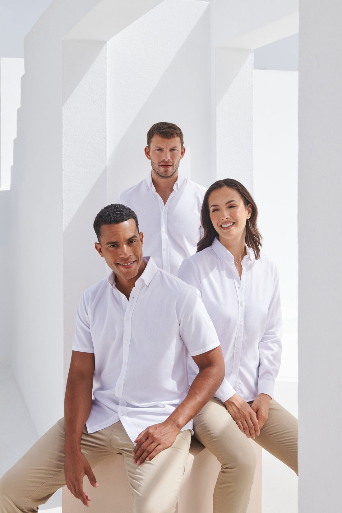 Image showing models wearing Henbury clothing - Color Coded Workwear