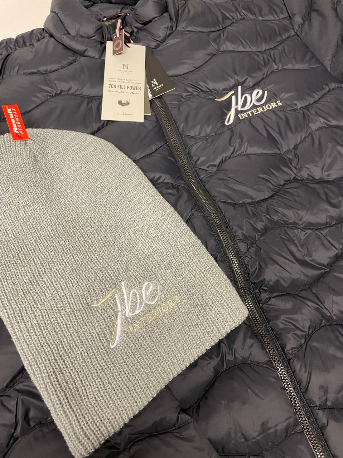 Photo showing embroidered logos on gilet and beanie - ColorCoded Workwear