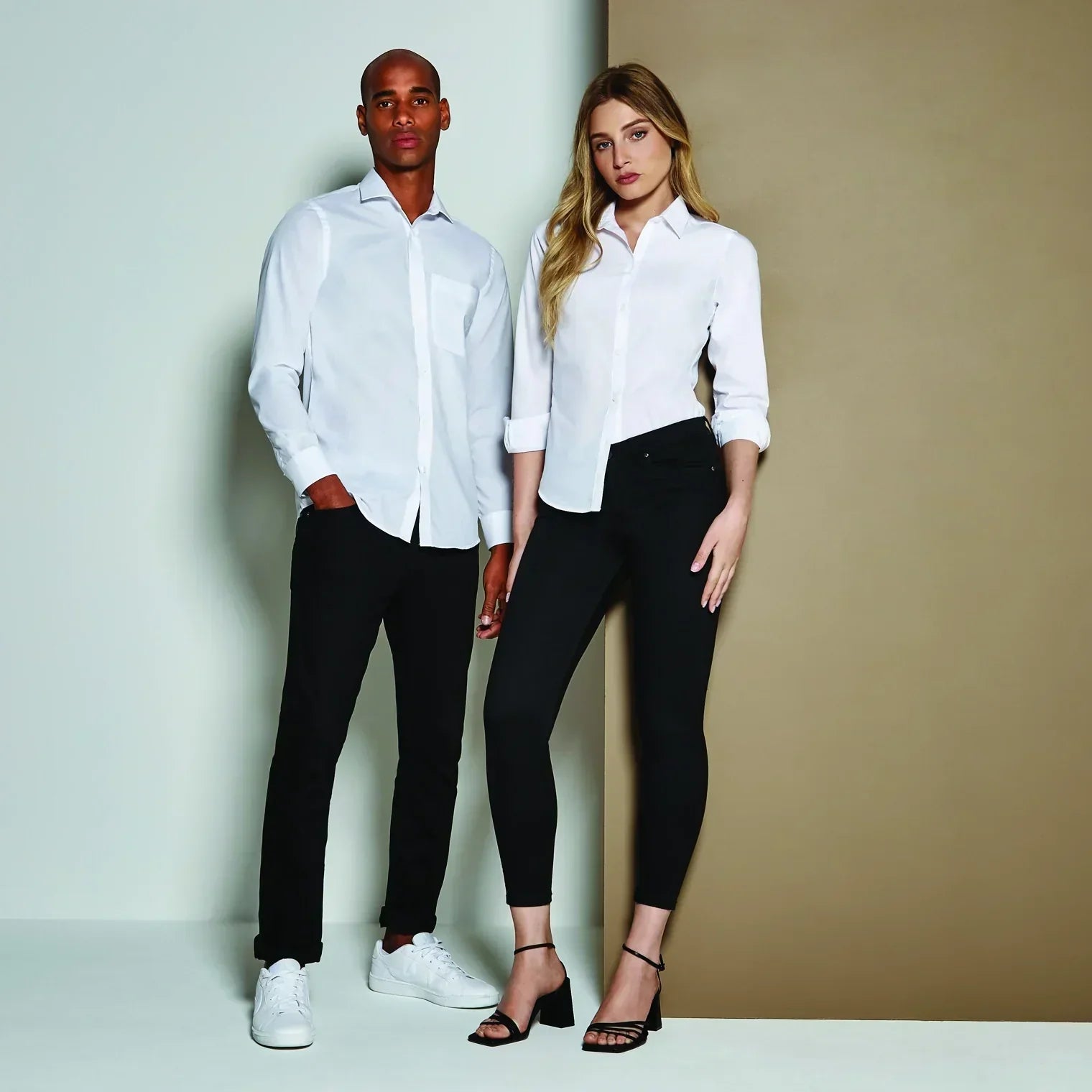 Models wearing Kustom Kit shirts and trousers - ColorCoded Workwear