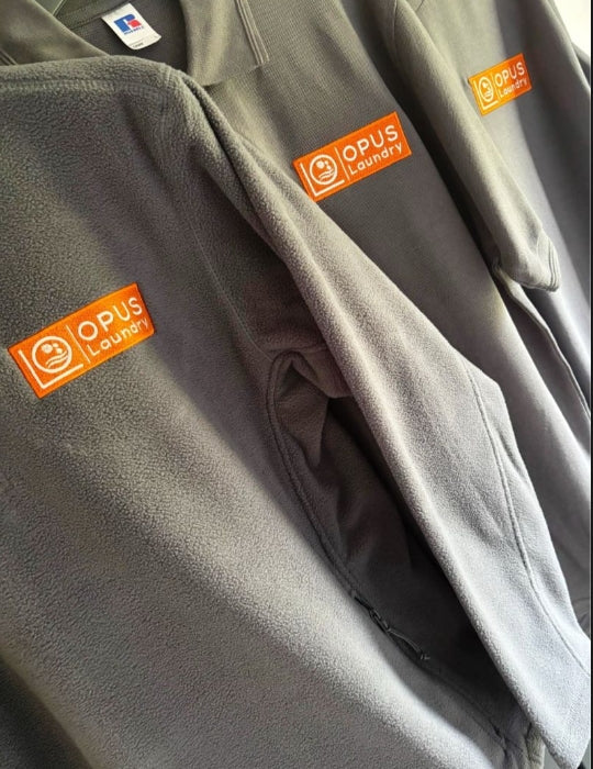 Professional embroidered logos to the front left chest area on fleece jackets for national brand - ColorCoded Workwear