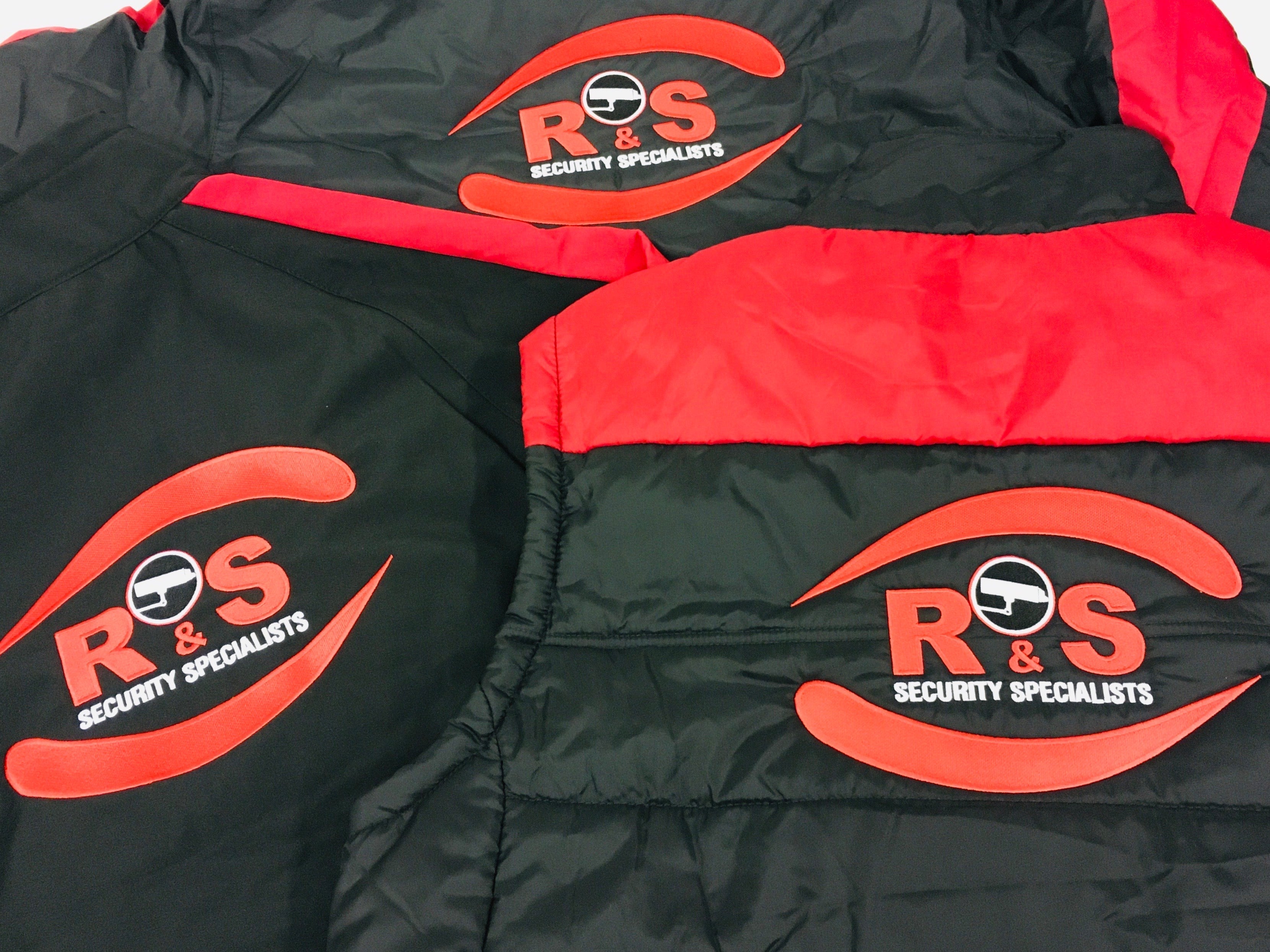 Photo showing large embroidered company logo on softshell jackets - ColorCoded Workwear