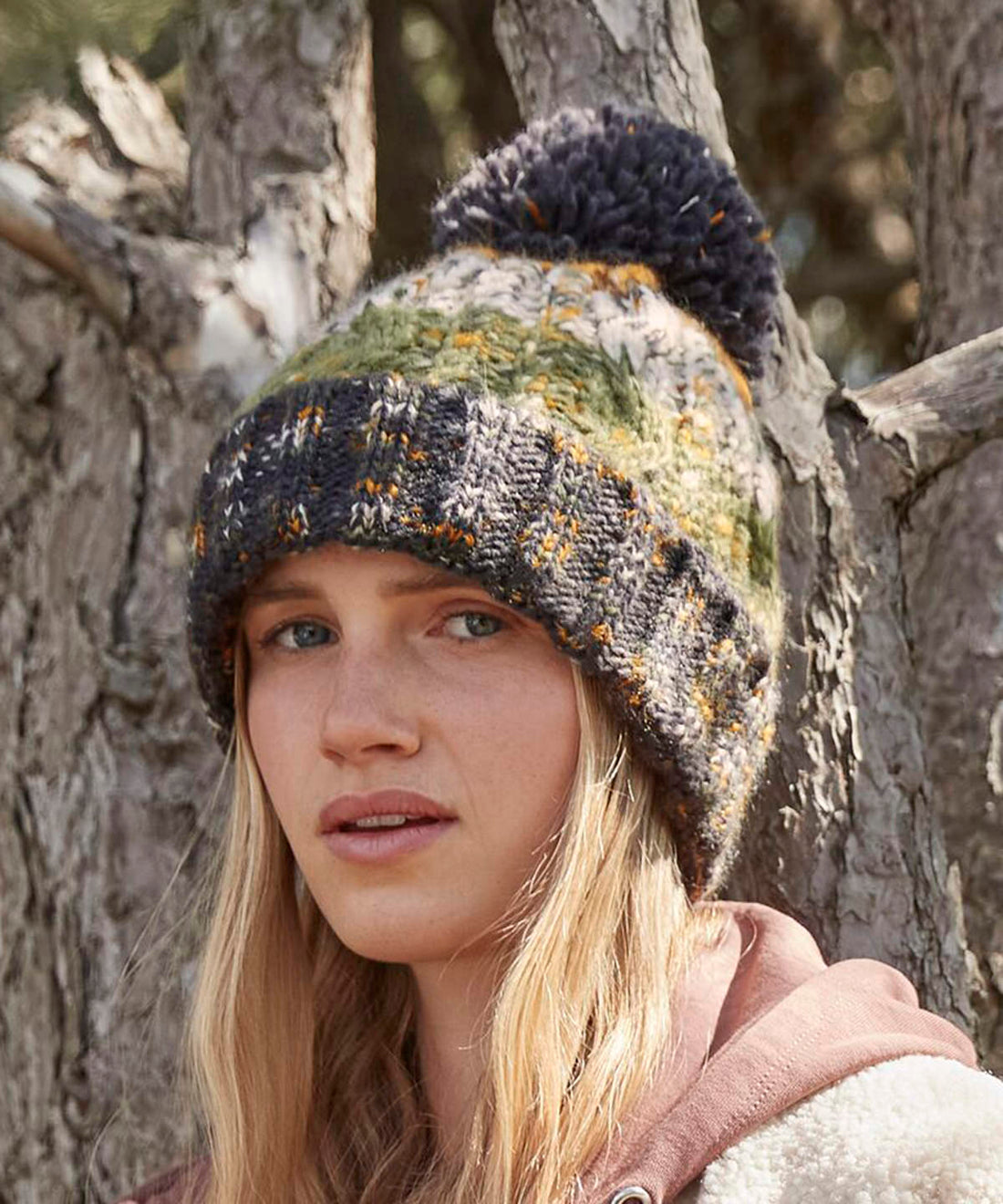 Model wearing Beechfield Corkscrew pom pom beanie - ColorCoded Workwear