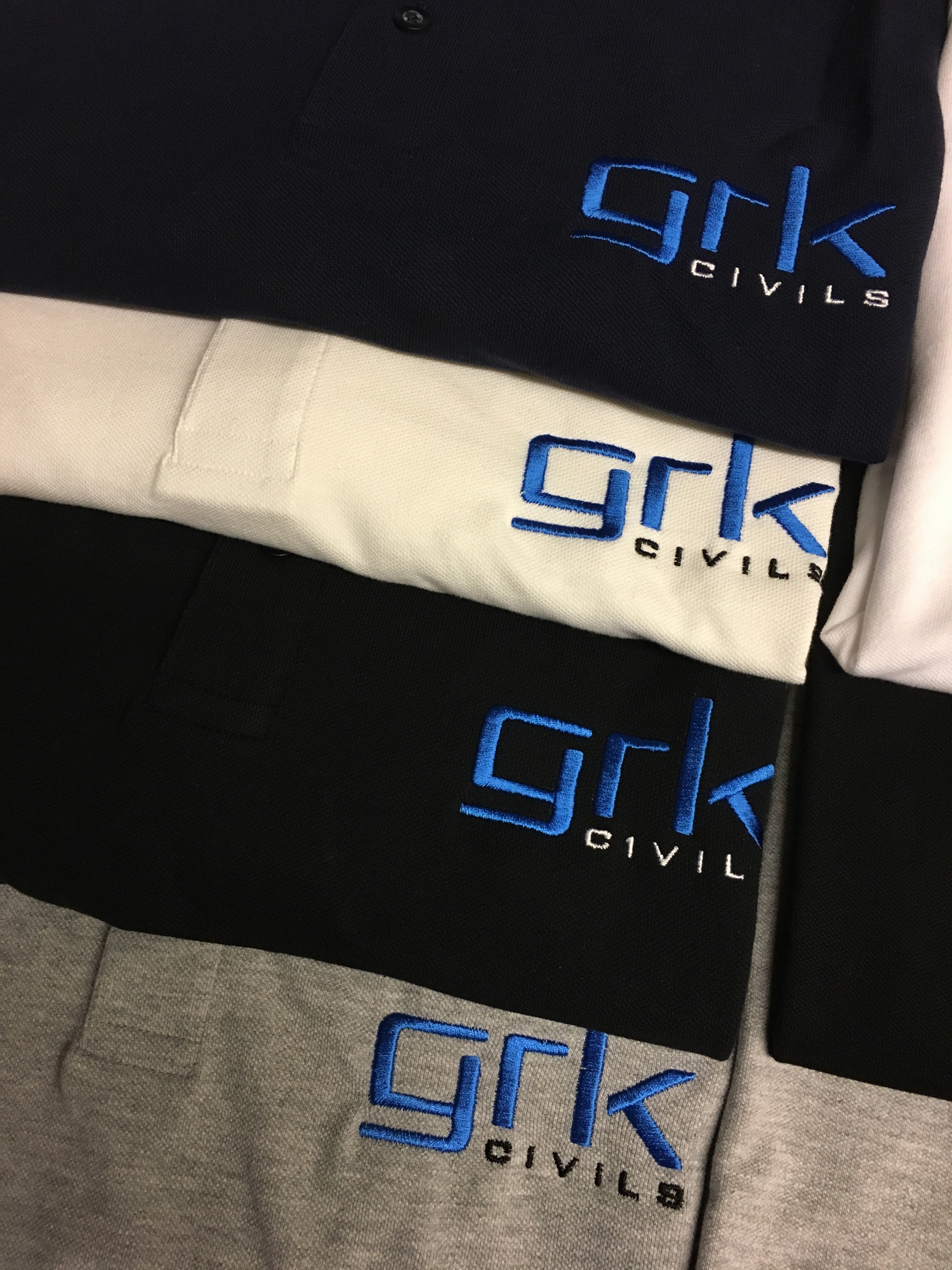 Professional embroidered logos on top quality polos for construction team - ColorCoded Workwear