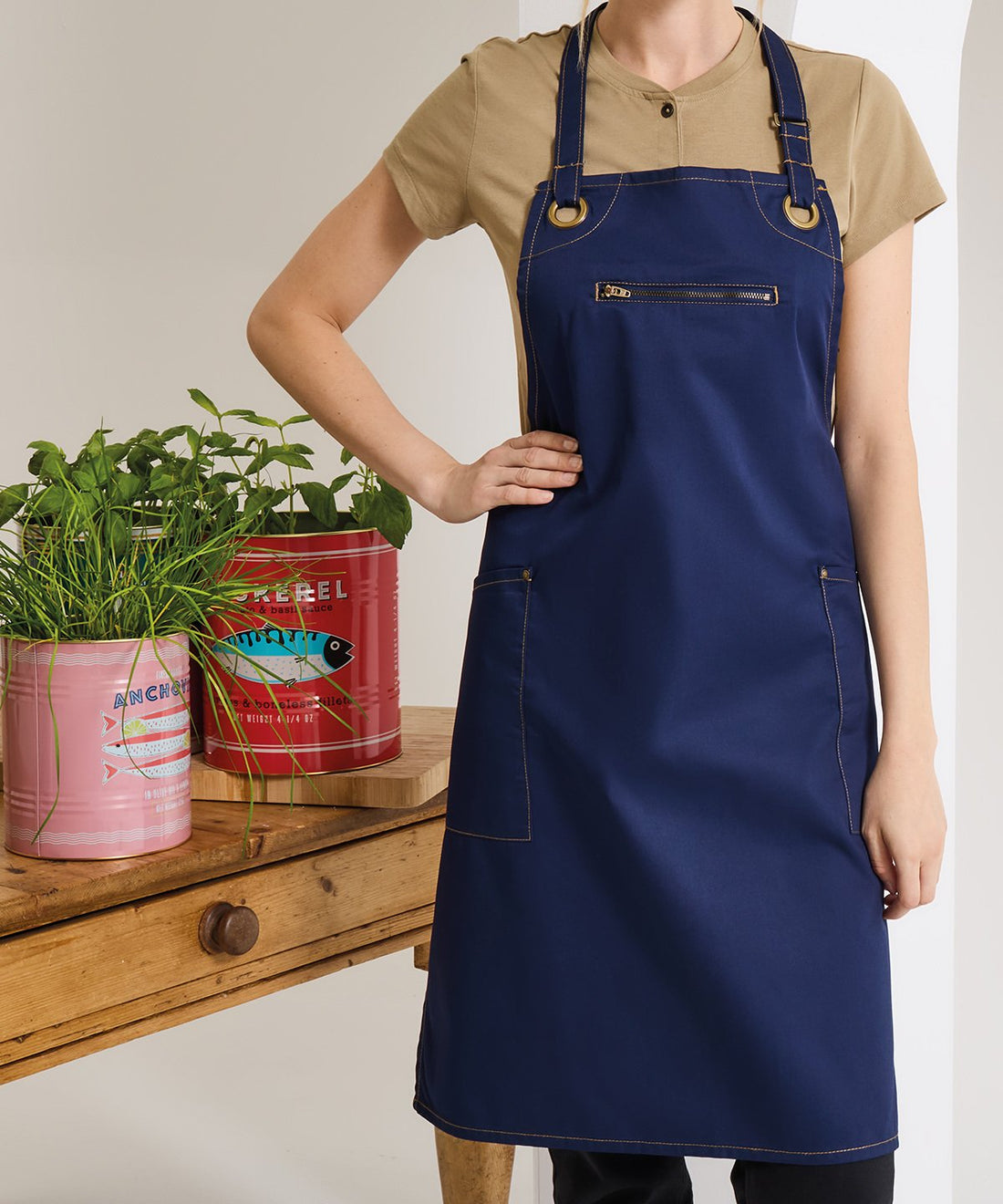 Model wearing Premier Barley Contrast Stitch bib apron - ColorCoded Workwear