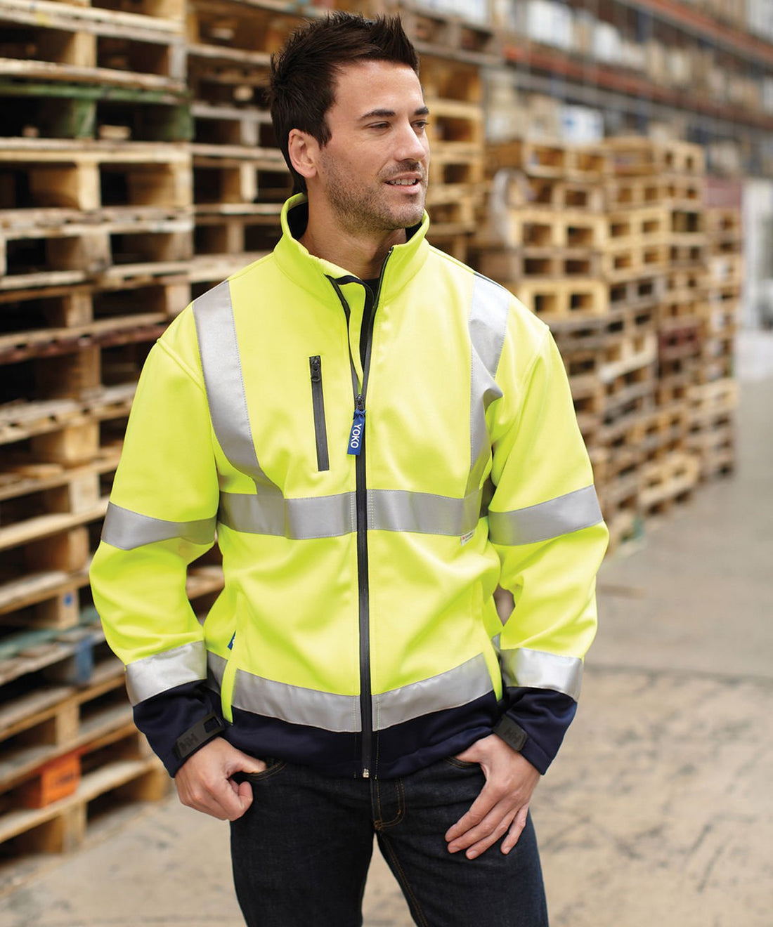 Worker wearing YOKO hi-vis softshell jacket - ColorCoded Workwear